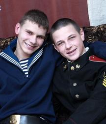 Russian sailor boy and cadet play with each other