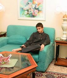 Arunas on green sofa 5743ecf00b66c.jpg
