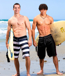 Austin Merrick & friend pose by beach