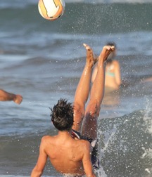playing football on the beach