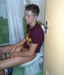 the boy is sitting on the toilet 5d2ae5d78f027.jpg