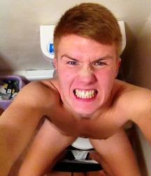 the boy is sitting on the toilet 5d2ae5da1f778.jpg