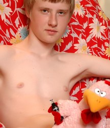 Pasha poses and cums on a red chair 5c48b337607b6.jpg