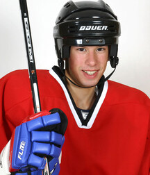 A cute hockey player shows off in the locker-room boys porn