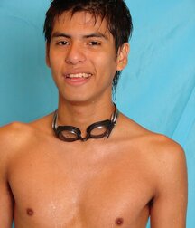 A dark-haired teen swimmer in a solo session