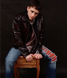 Tough guy look with leather jacket.Wish he would smile. 5bbd4a5ab1aaa.jpg