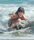 cute boys surfing