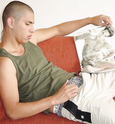 Uncut Skinhead Twink on a sofa eats his cum 
