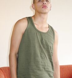 Uncut Skinhead Twink on a sofa eats his cum 