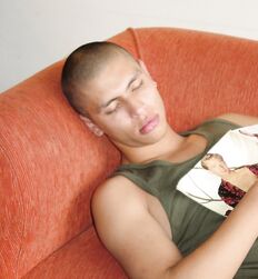 Uncut Skinhead Twink on a sofa eats his cum 