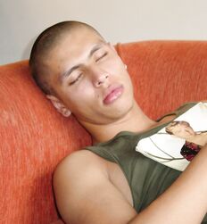 Uncut Skinhead Twink on a sofa eats his cum 