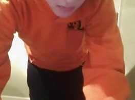 with his pullover orange