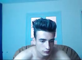 Young man in blue room