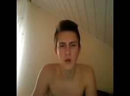 cute guy masturbates on the couch