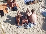 4 guys playing on nude beach