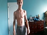 Cute blonde teen flexes his hard muscles
