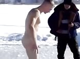 Russian guys dive into icy water