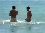 Two naked friends at the sea