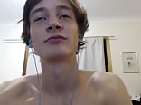 A smiling boy masturbates in his bedroom 1