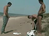 three boys on the beach naked
