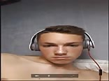Young blonde boy porn wanks with headphones on