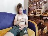 Young guy jerks off on the couch