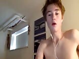 Shaved twink porn drops a load on his belly