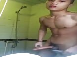 Asian twink porn wanks off a load in his bathroom.