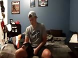Baseball jock gets off watching gay porn on his phone